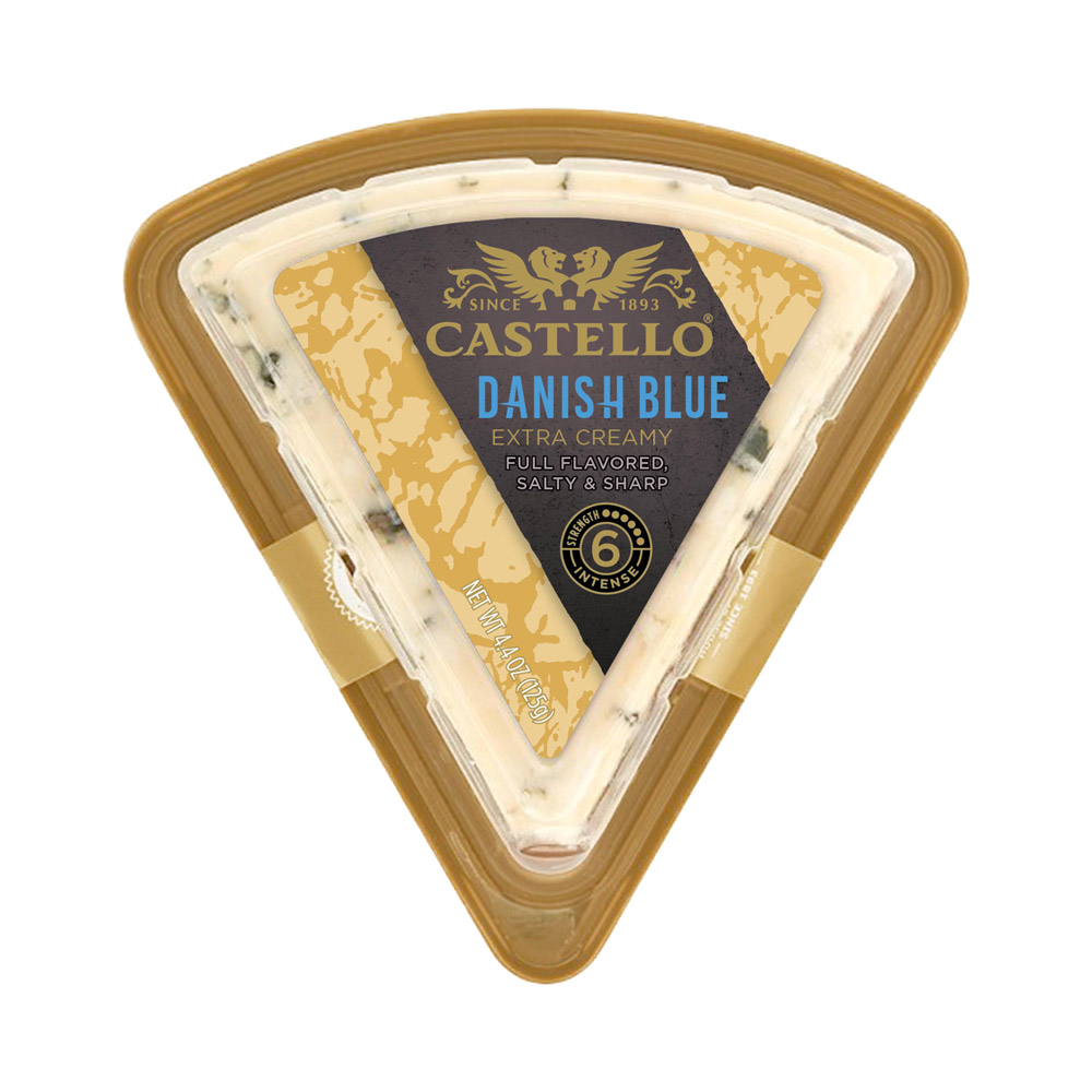 A wedge of Castello Extra Creamy Blue Cheese in the packaging