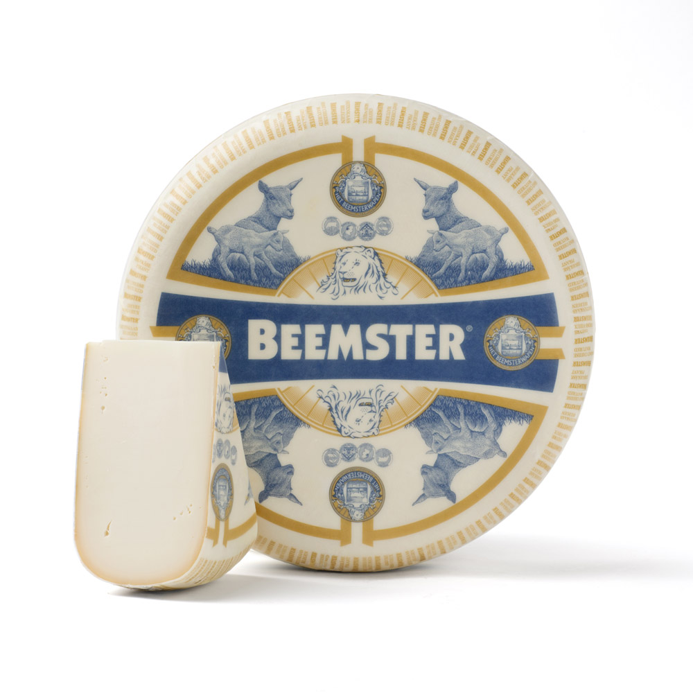 Wheel and a wedge of Beemster goat’s milk gouda cheese