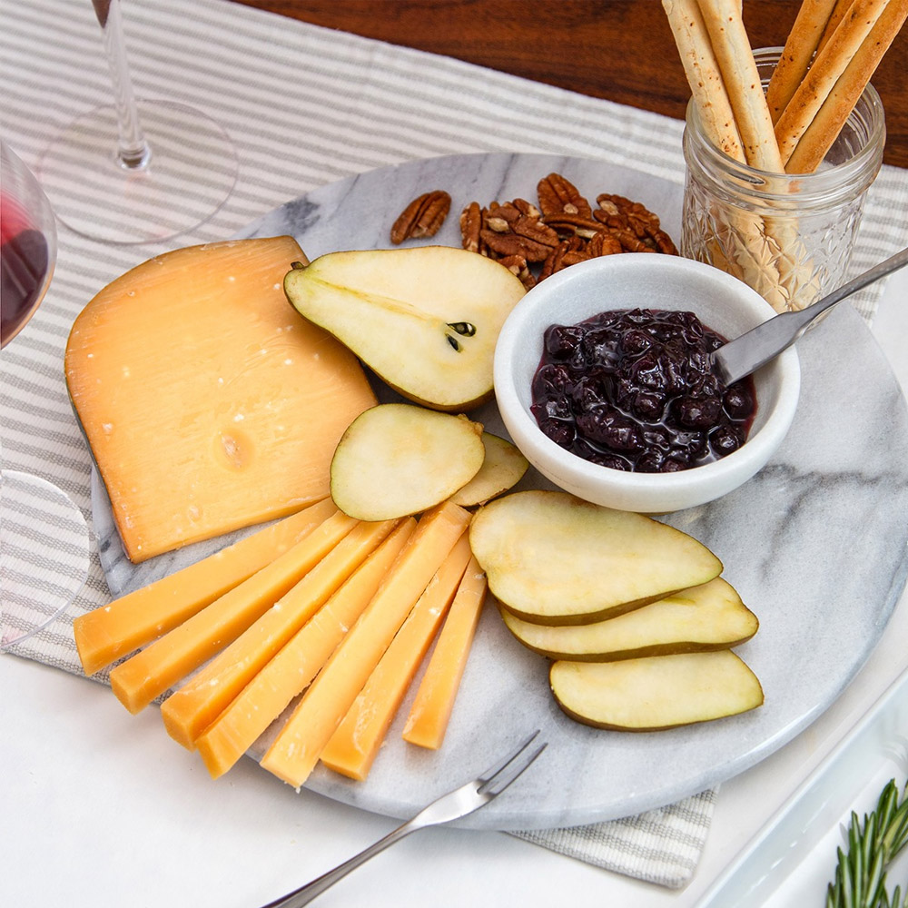 A cheese plate with Vermeer and other snacks