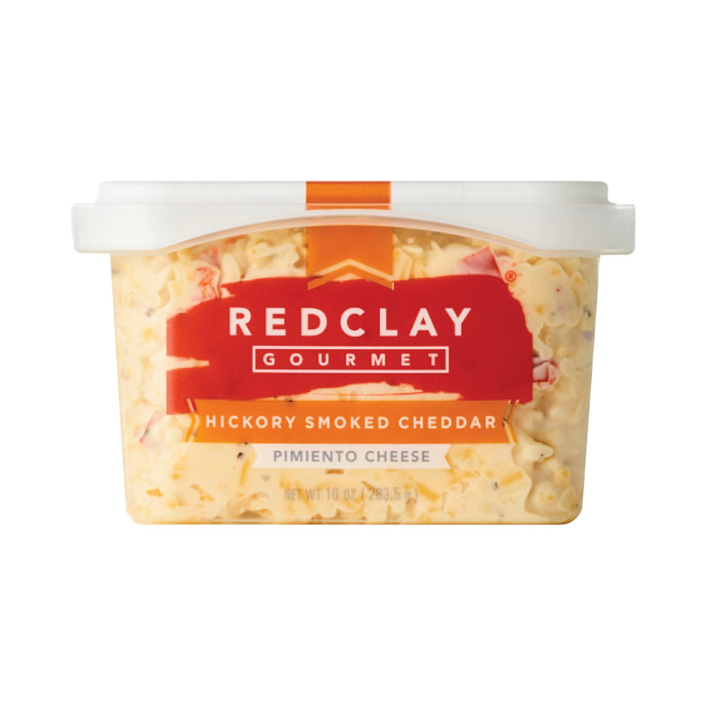Container of Red Clay Gourmet hickory smoked cheddar pimiento cheese