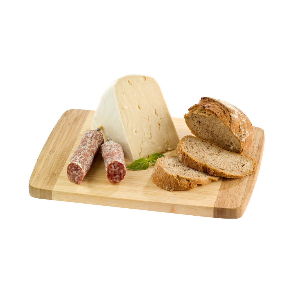 A wedge of Chevre au Lait cheese on a wood board with a salami chub and some bread slices