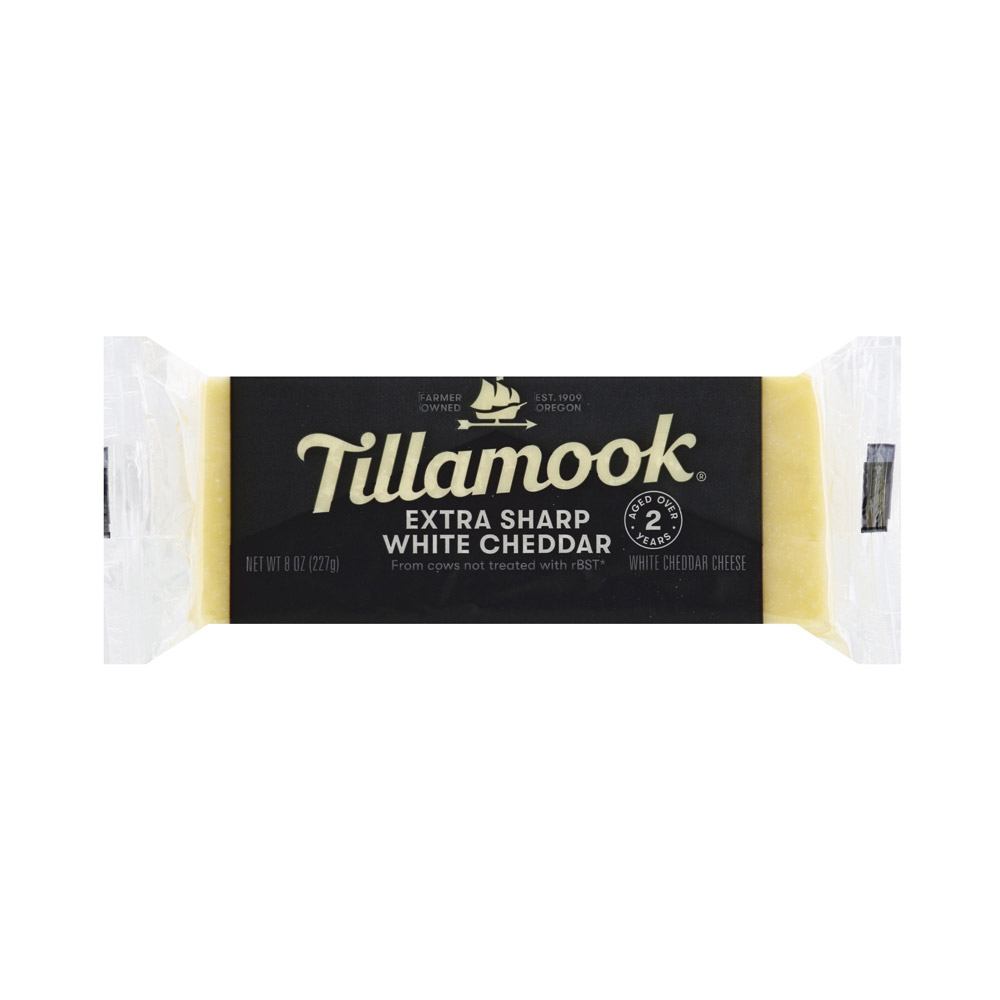 A bar of Tillamook extra sharp white cheddar cheese