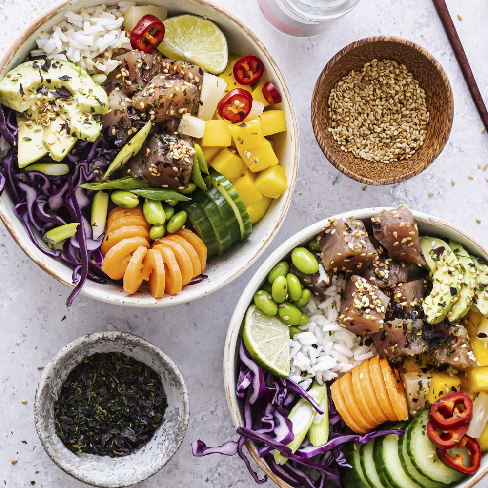 Two Tuna poke bowls with tuna and vegetables and rice
