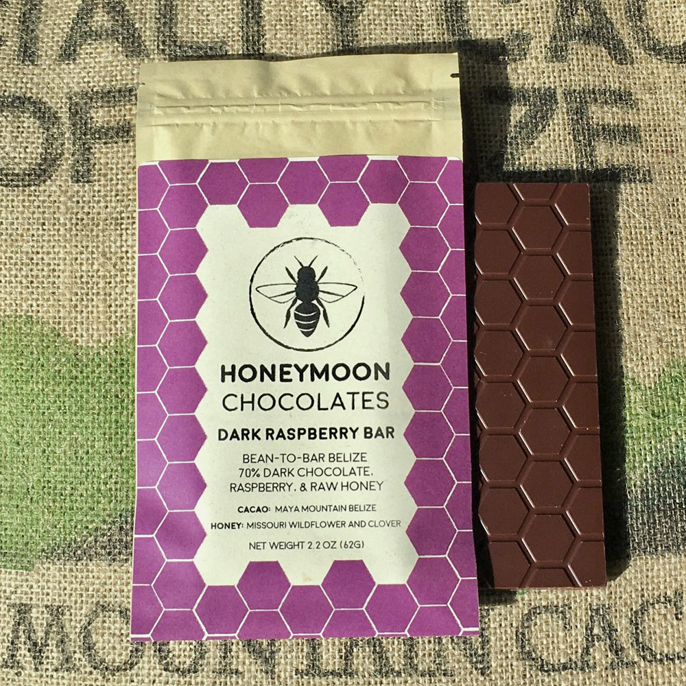 The front of a Honeymoon Chocolates 70% Belize & Raspberry Dark Chocolate Bar