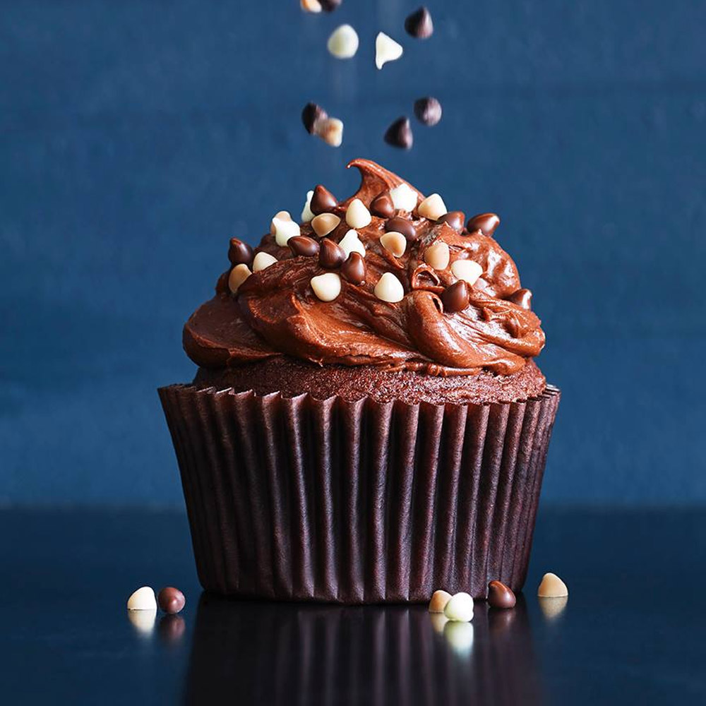 A cupcake topped with chocolate chips
