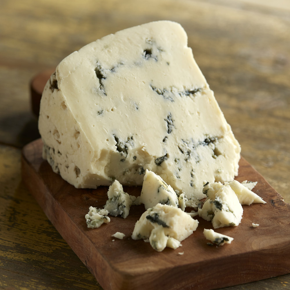 FireFly Farms Black & Blue Cheese Wedge on a board