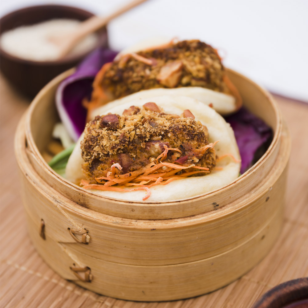 Close-up of traditional food gua bao steam buns in bamboo steamer