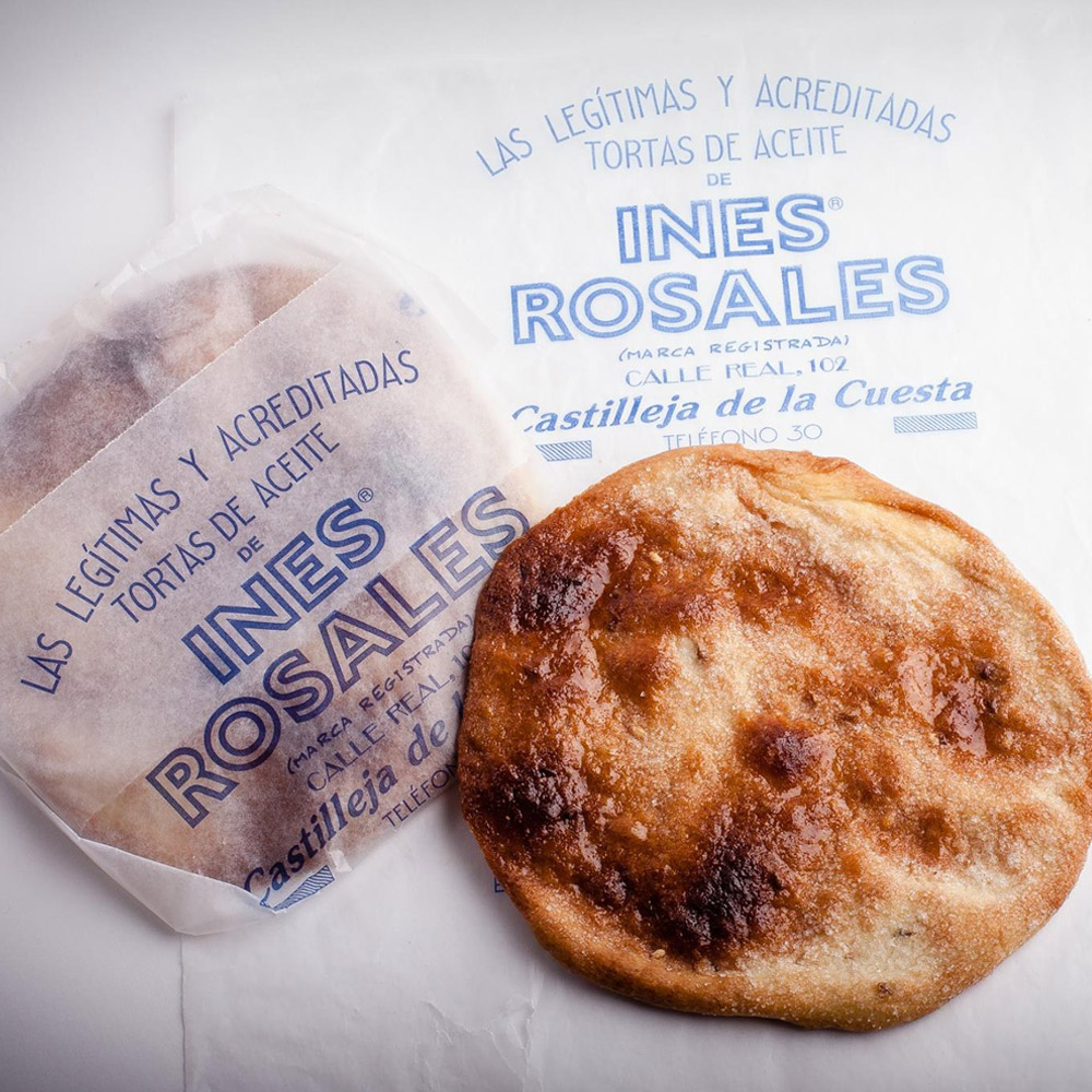 A torta out of the packaging next to a torta inside the packaging