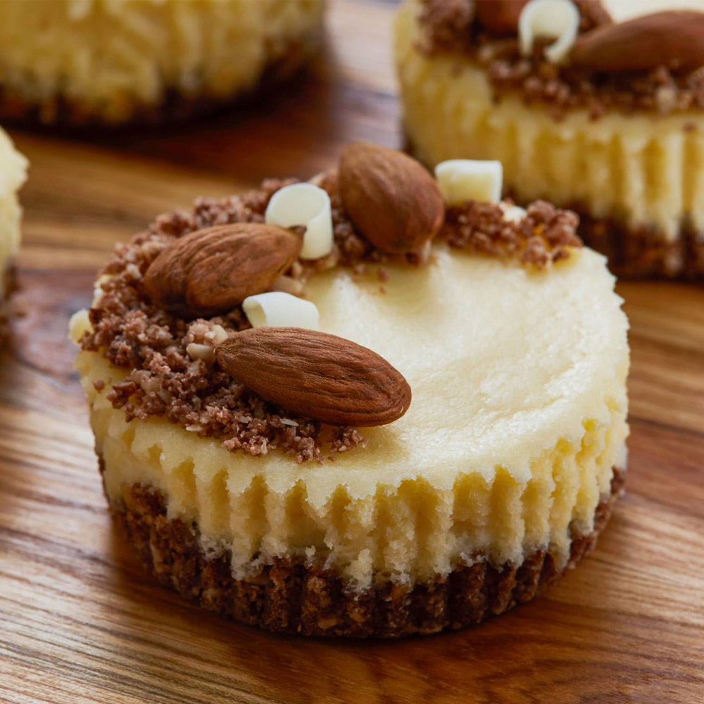 A mini almond cheesecake topped with almonds