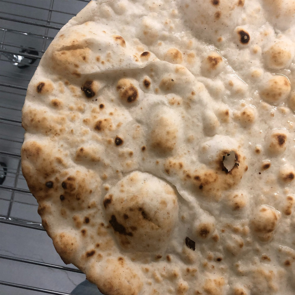 A close-up of a Zero Gluten Foods 12" Gluten Free Pizza Crust