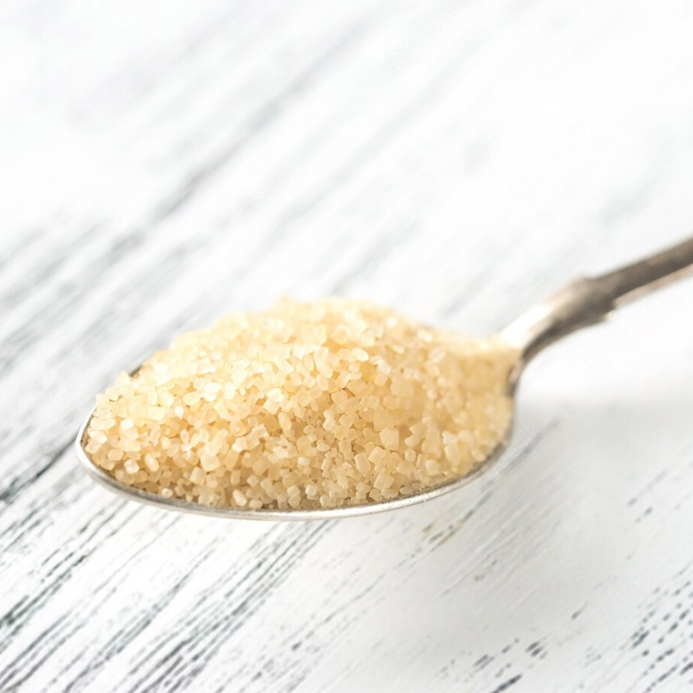 Turbinado sugar on a spoon