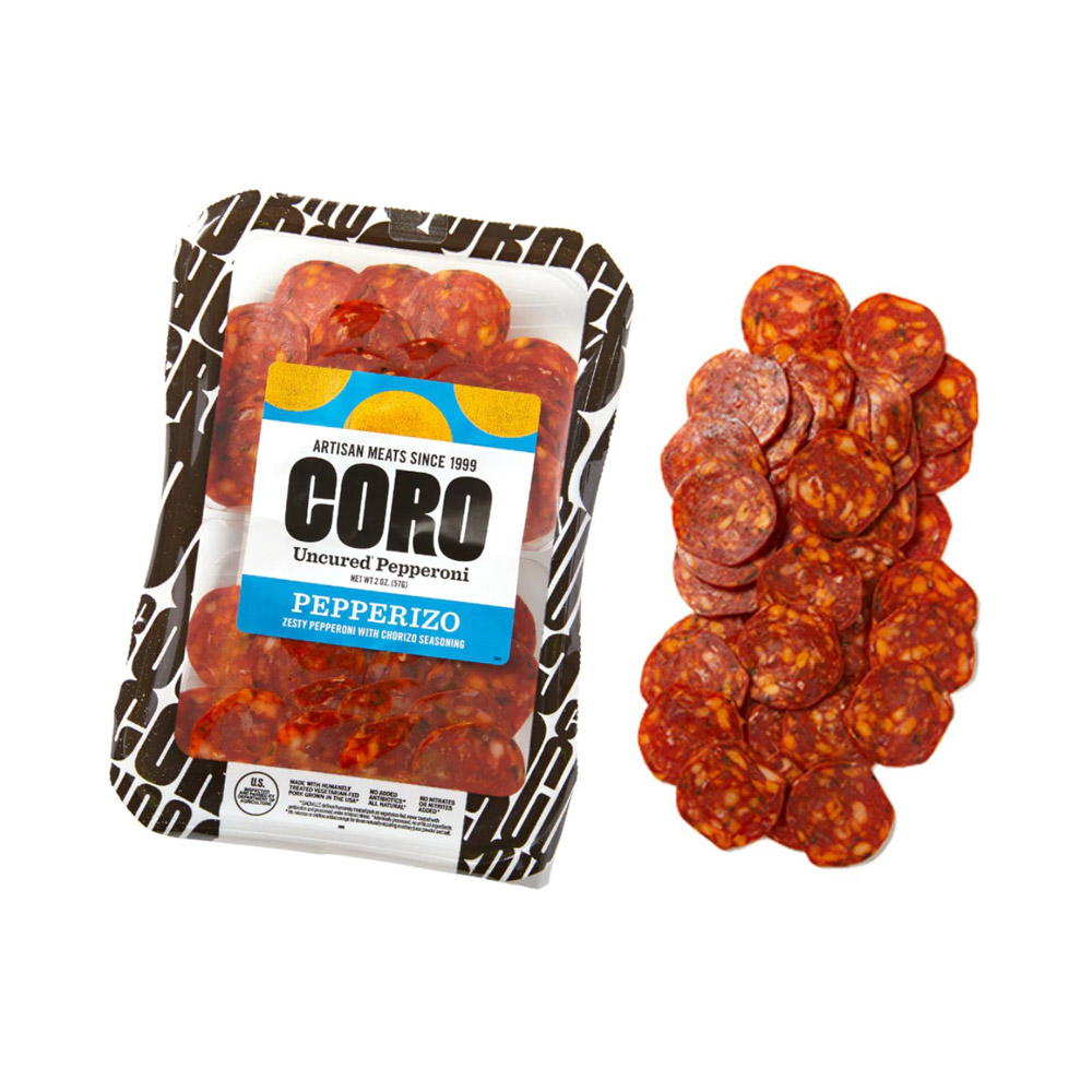 A package of Coro sliced pepperizo pepperoni next to a pile of pepperoni slices