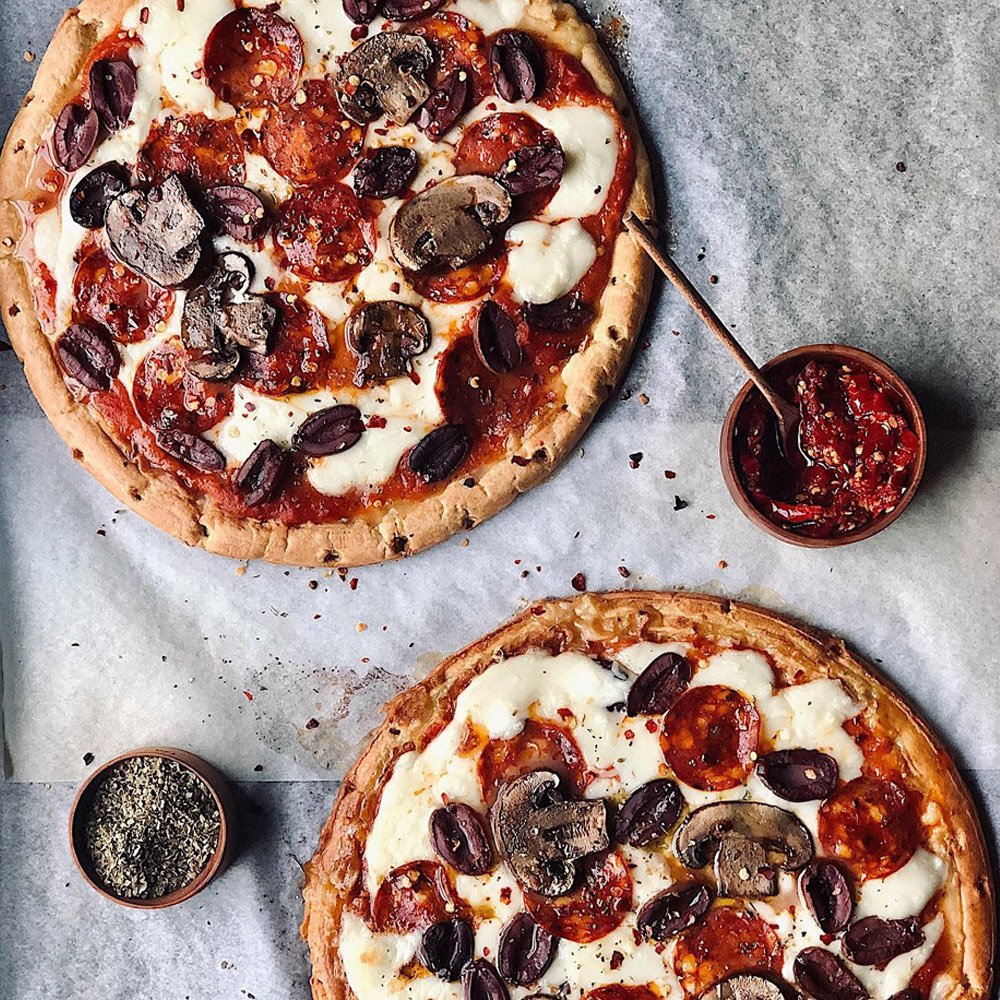 Two pepperoni and mushroom pizzas