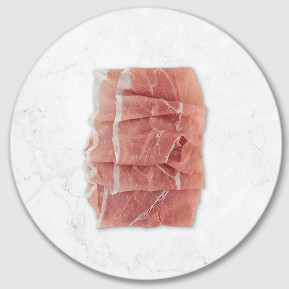 Slices of prosciutto on a marble board