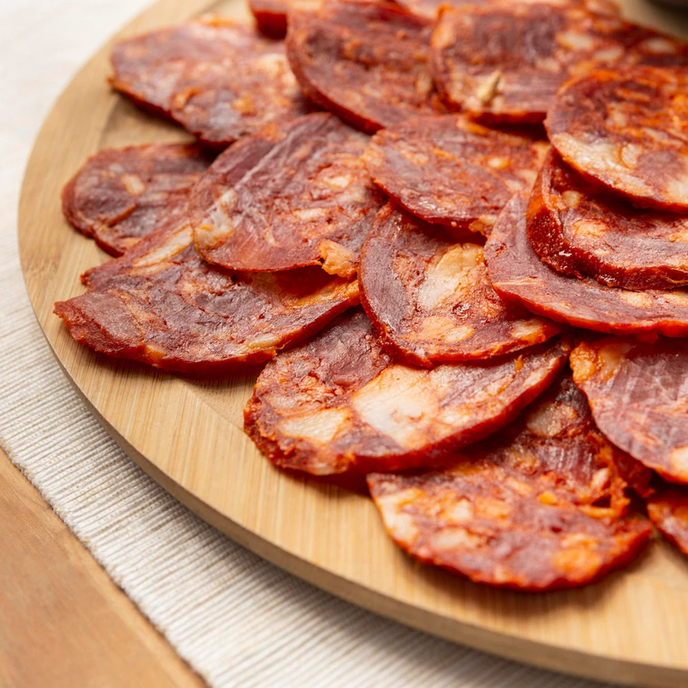 Slices of chorizo on a wood board