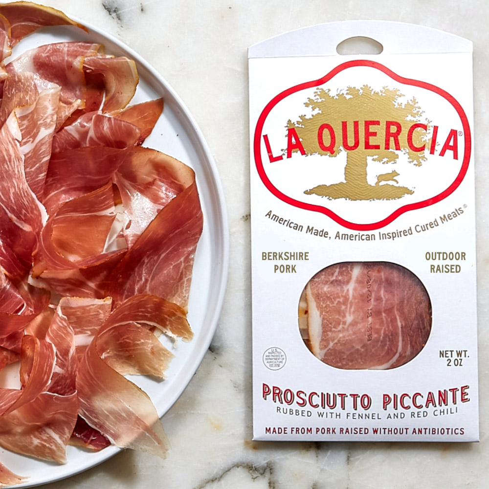 la quercia sliced prosciutto piccante on plate and la quercia sliced prosciutto piccante in packaging