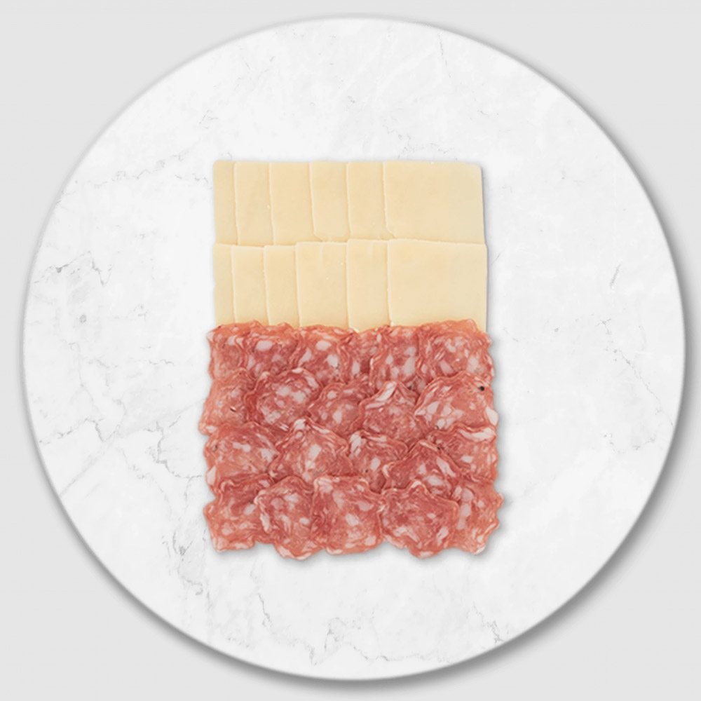 Sliced salami and cheese on a marble board