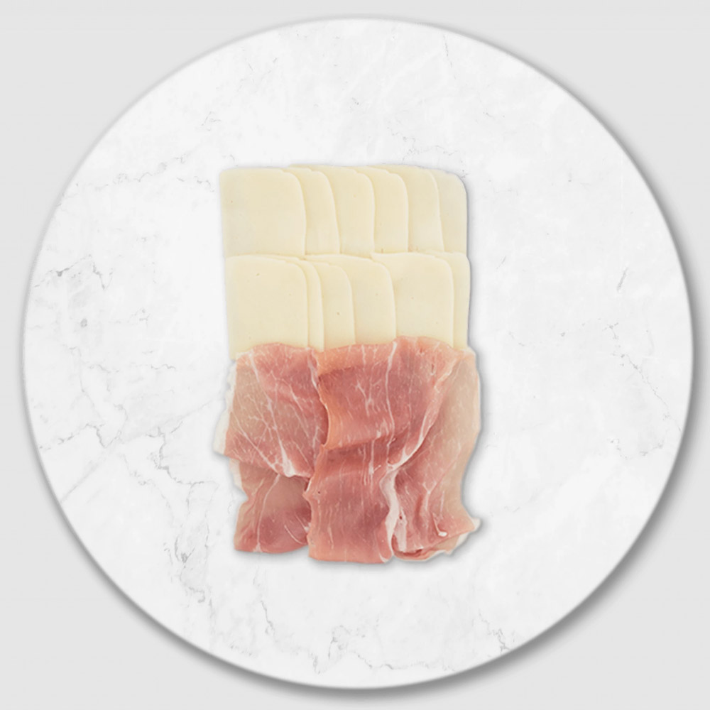 Slices of prosciutto and cheese on a marble board
