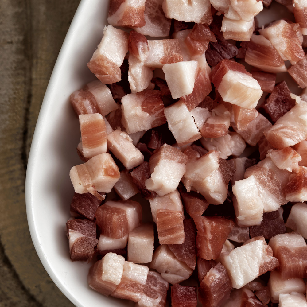 A bowl of cubed pancetta