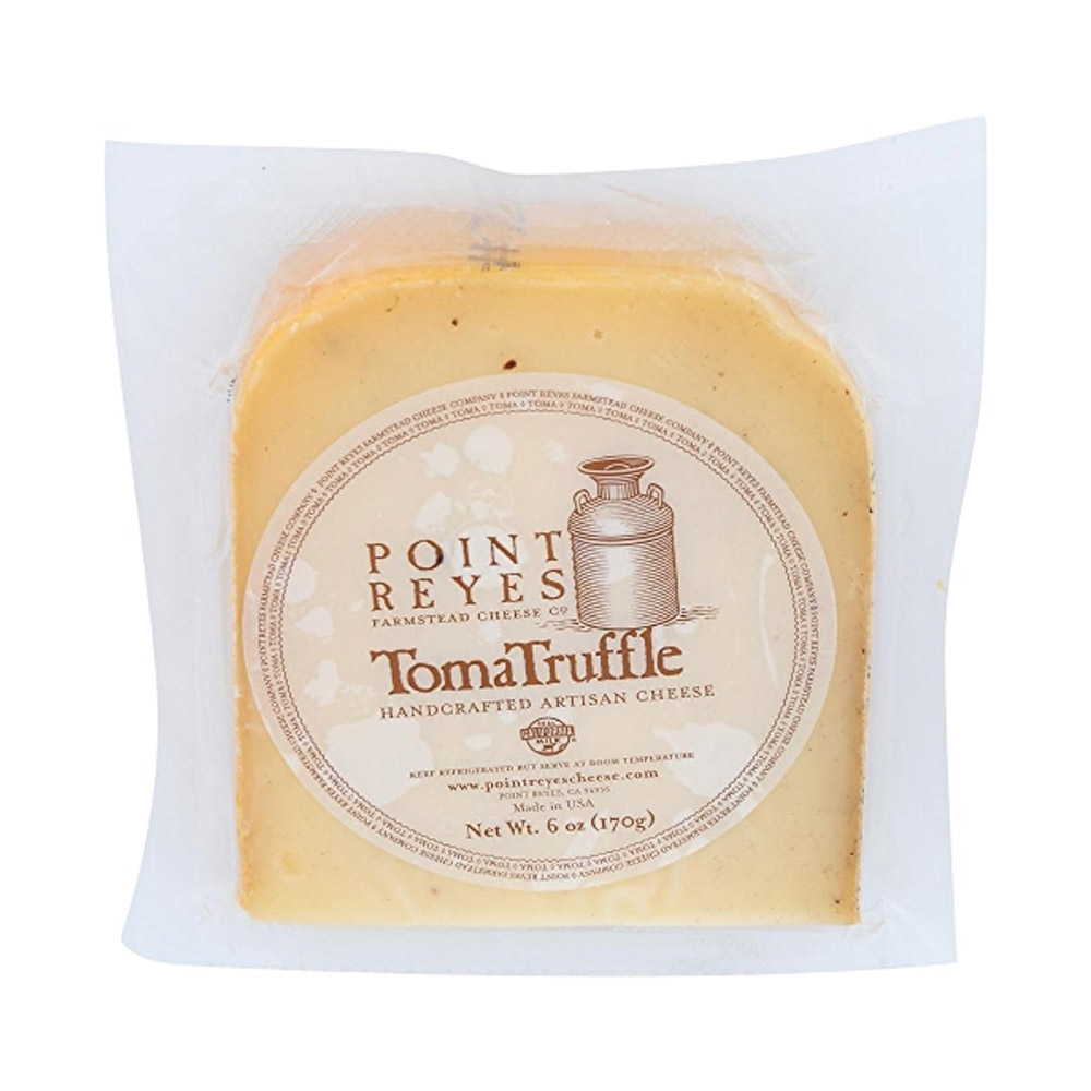 A wedge of TomaTruffle cheese in the packaging