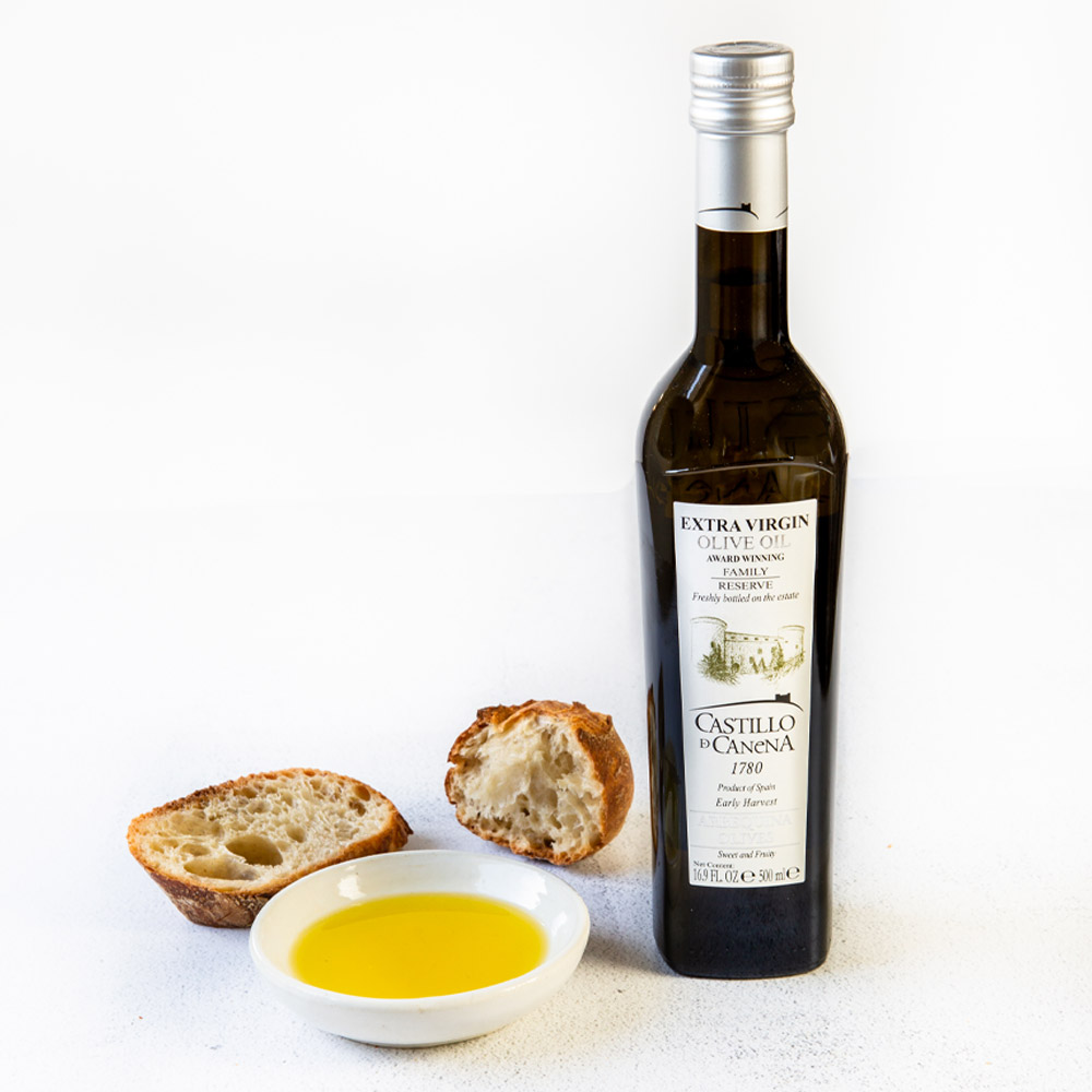 bottle of columela sherry vinegar in cup with bottle and bread