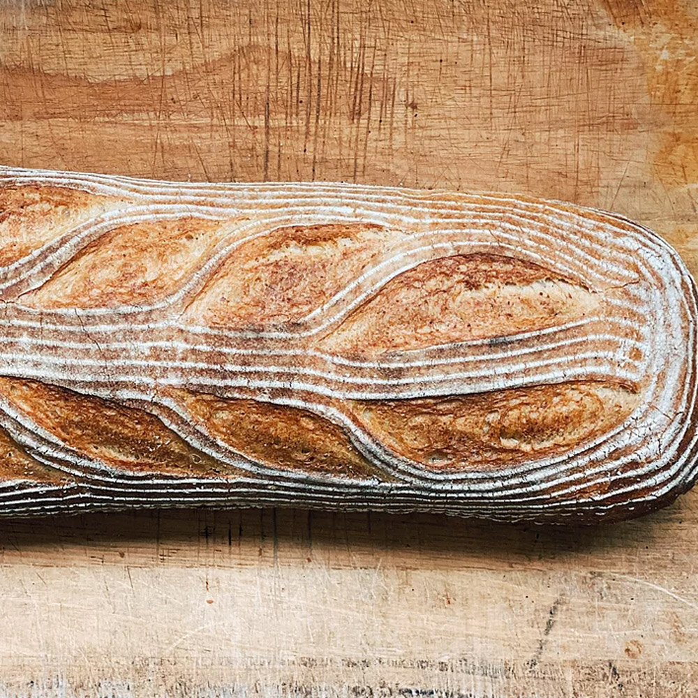 mediterra bakehouse sliced farm bread deli loaf on table