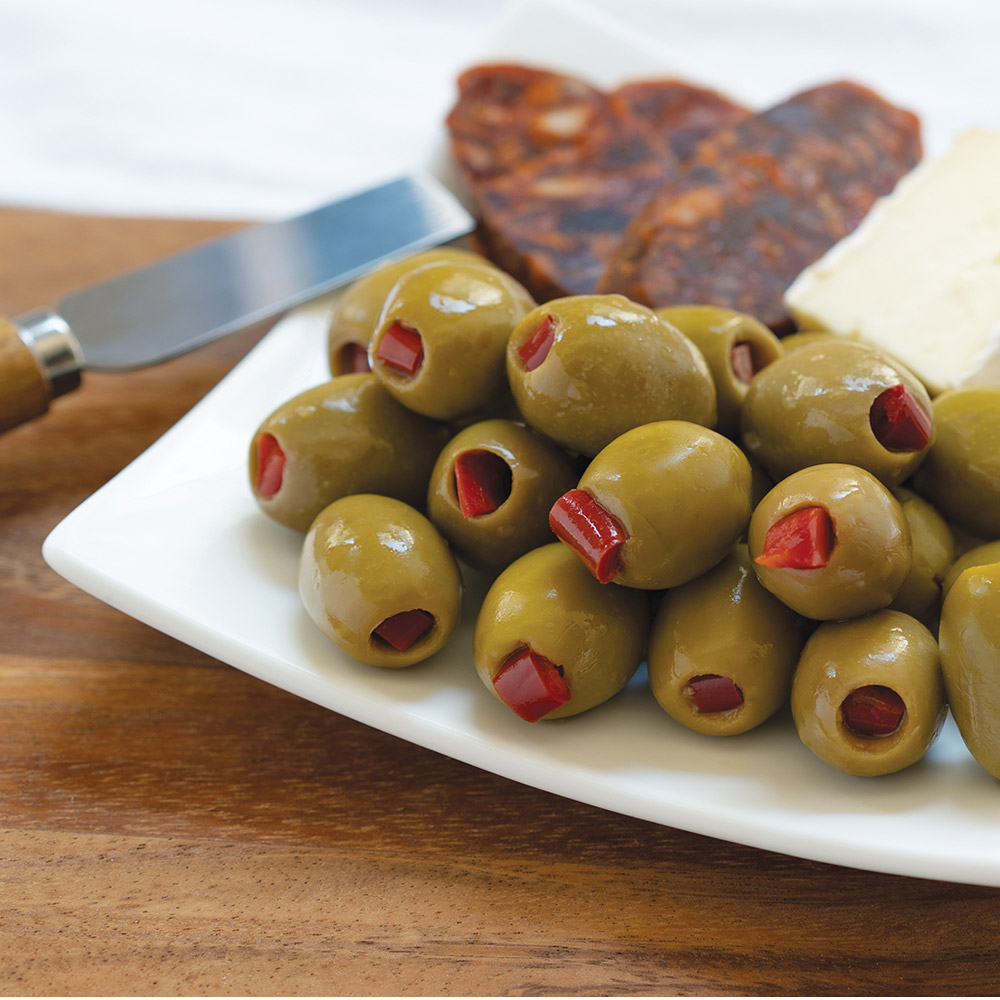 divina mt. athos green olives stuffed with red peppers on plate