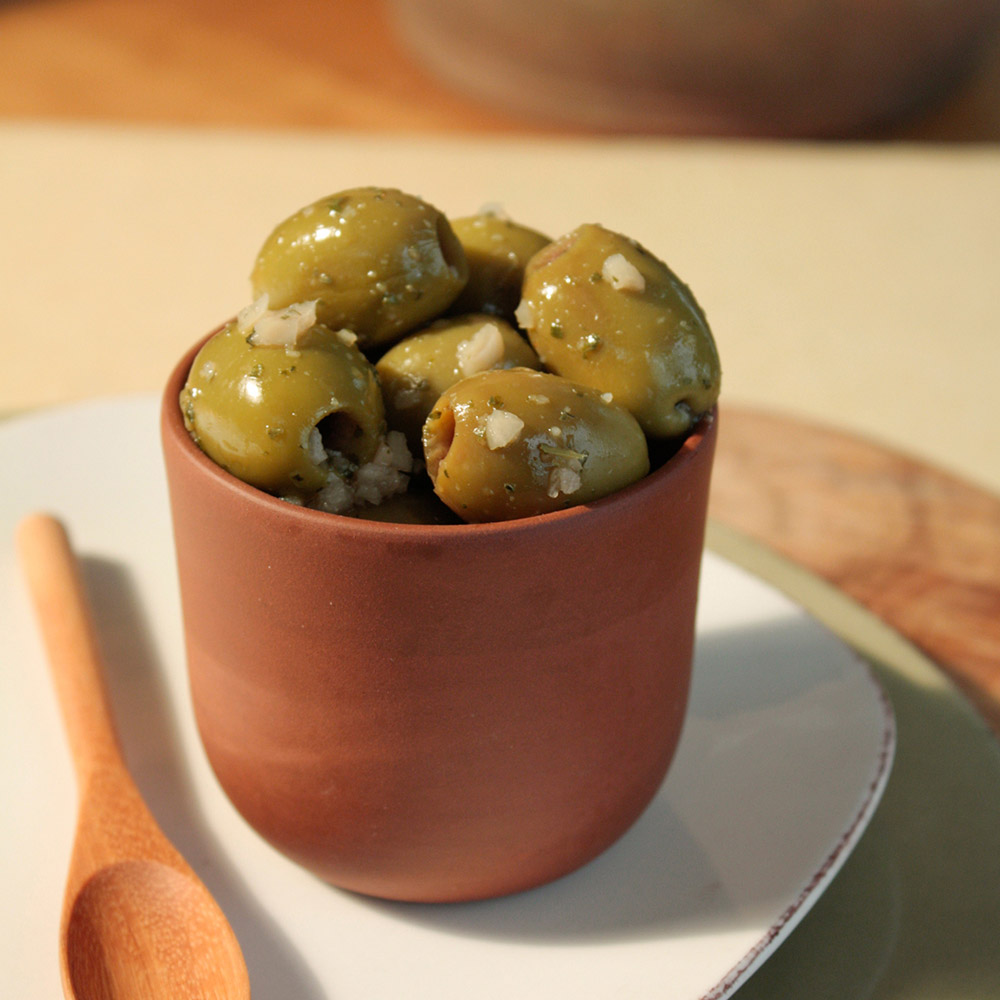 divina pitted minced garlic marinated mt. athos green olives in bowl