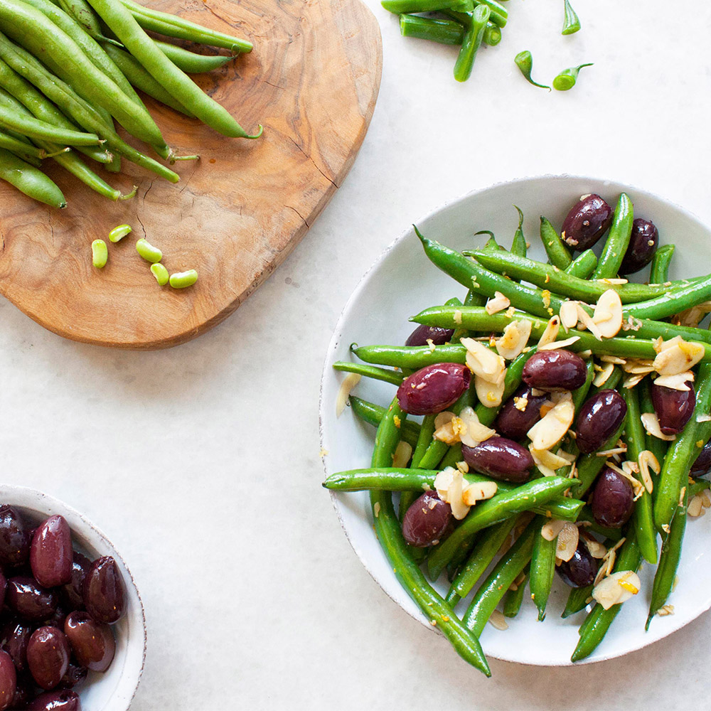 divina organic pitted kalamata olives with green beans in bowl