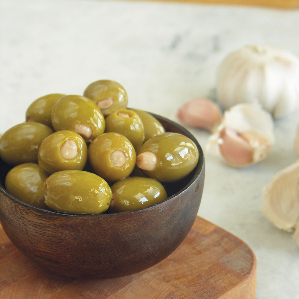 divina green olives stuffed with garlic in bowl