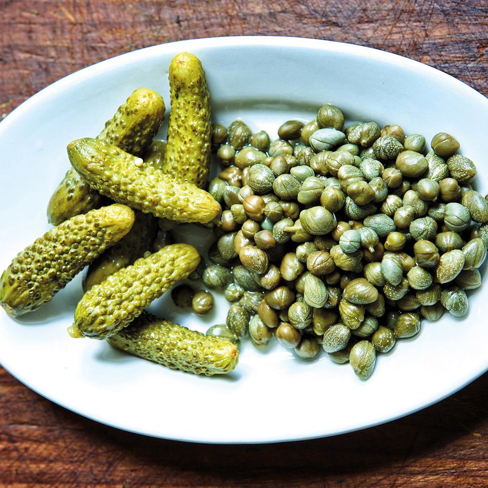 Divina non-pareil capers on a plate with accompaniments