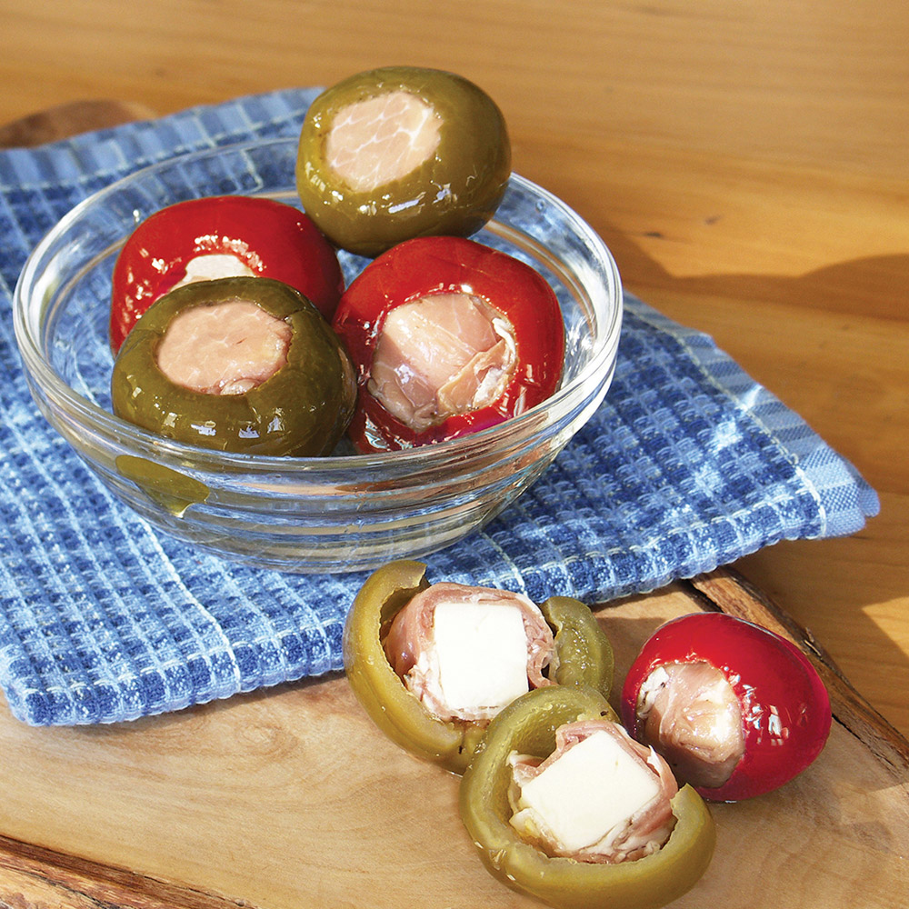 Divina cherry peppers stuffed with prosciutto and provolone in a bowl