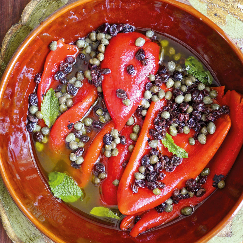 Divina roasted red peppers in bowl with accompaniments
