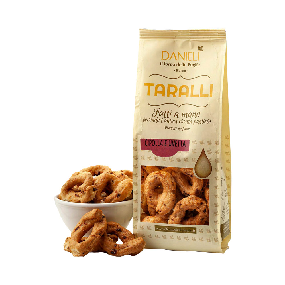 A bag of taralli crackers next to a bowl filled with taralli crackers.