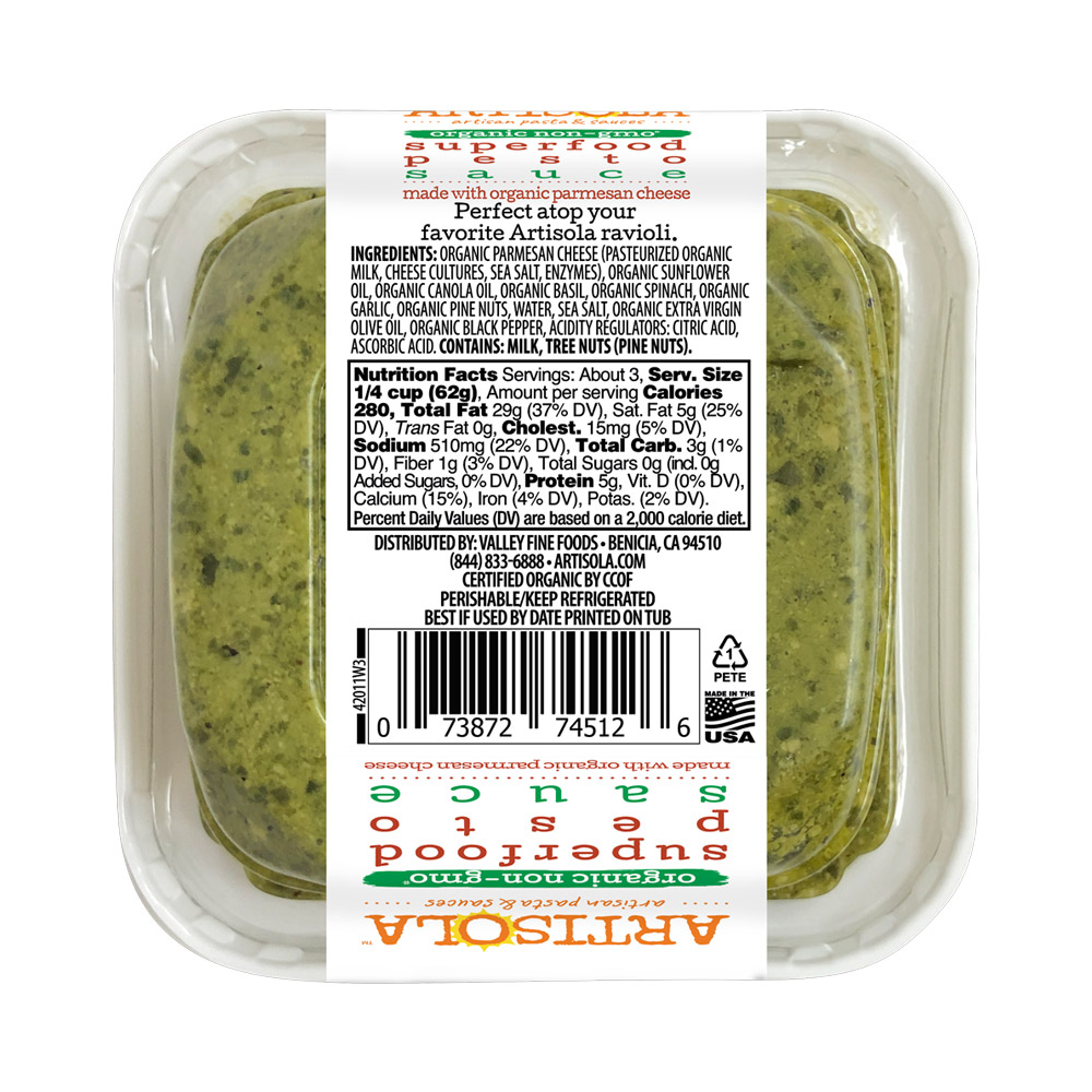 The bottom of a container of Artisola organic superfood pesto sauce