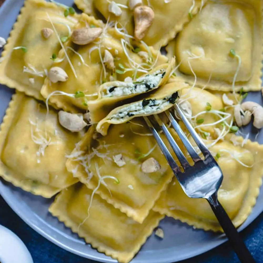 Nuovo pasta chicken and cheese Florentine ravioli on plate with fork