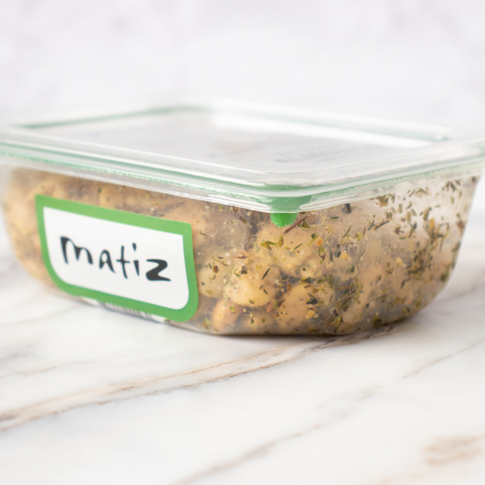 The side view of a container of Matiz Valencia Almonds with Herbs