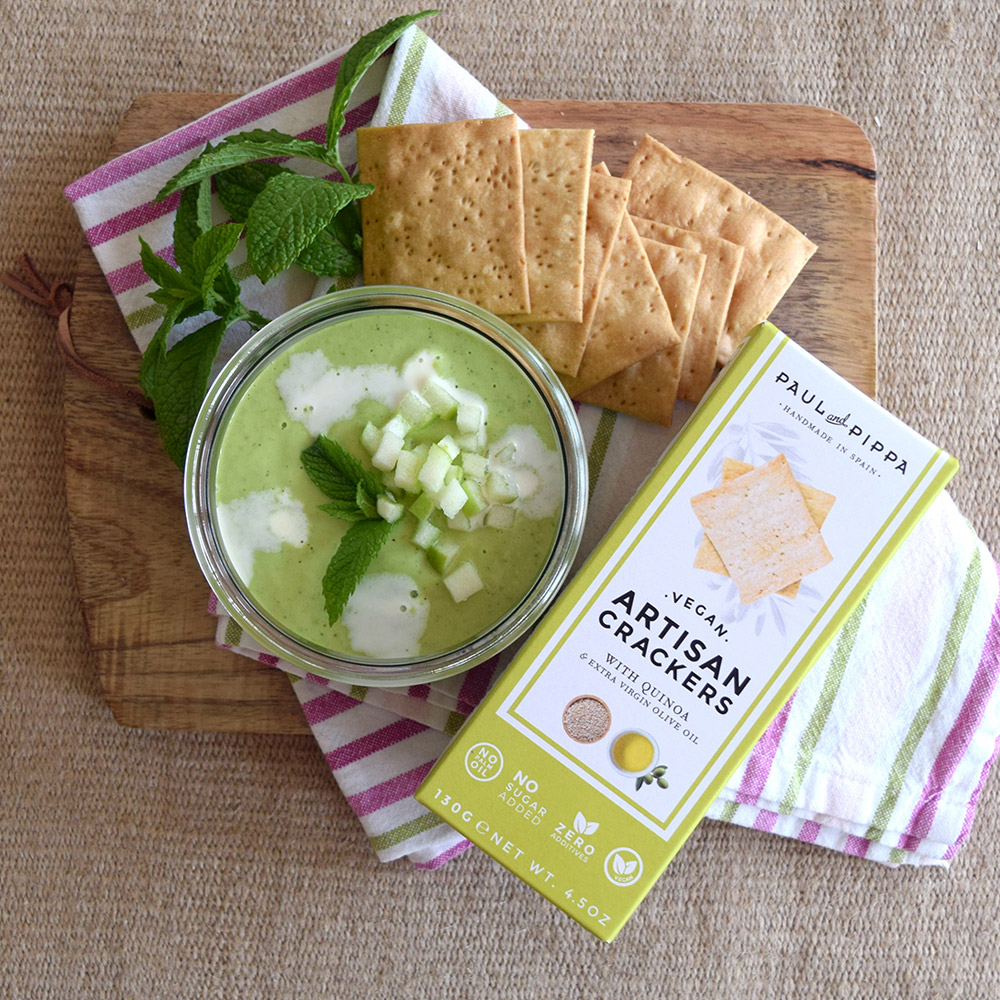 Paul and pippa artisan quinoa crackers on cutting board with accompaniments