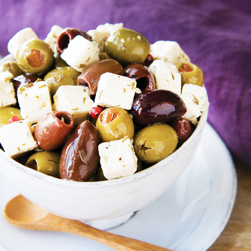 castello marinated danish feta & pitted olives in oil in bowl