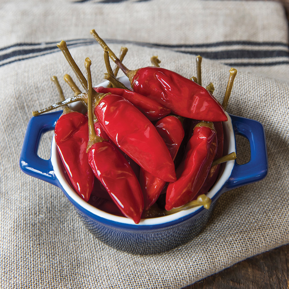 divina calabrian chili peppers in oil in bowl