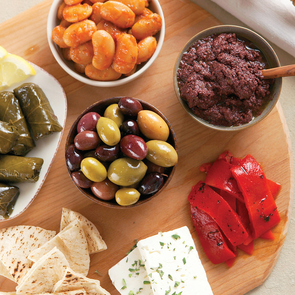 divina organic greek olive mix in bowl with beans and peppers and cheese and grape leaves
