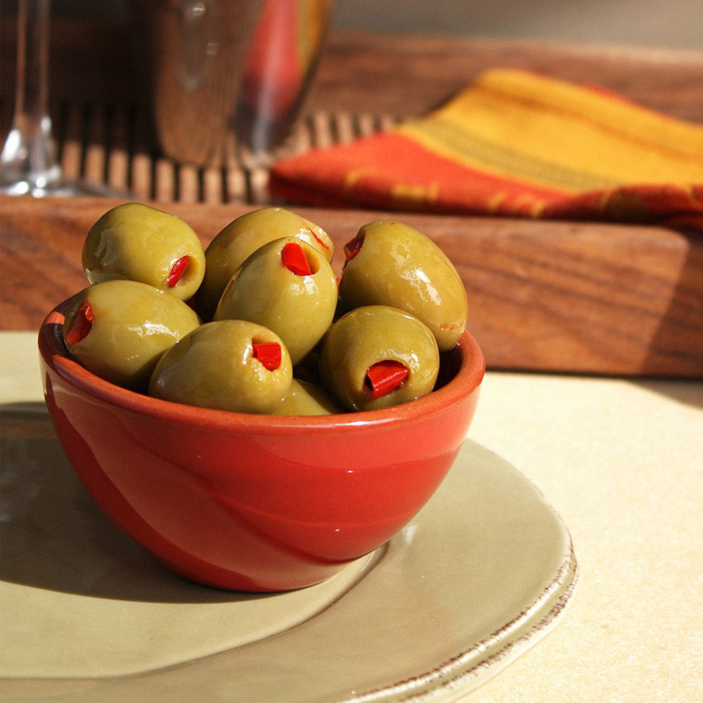 divina green olives stuffed with red pepper in bowl