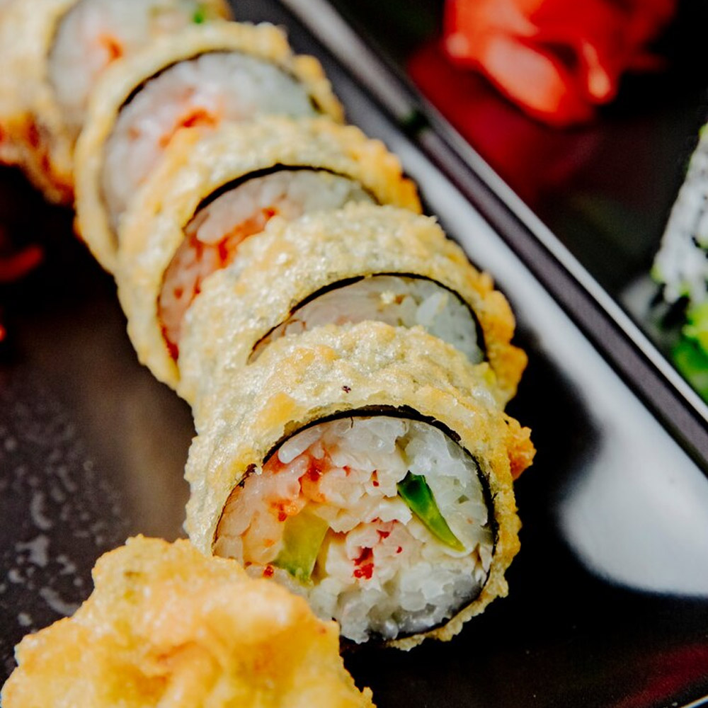 Sliced tempura dipped sushi roll